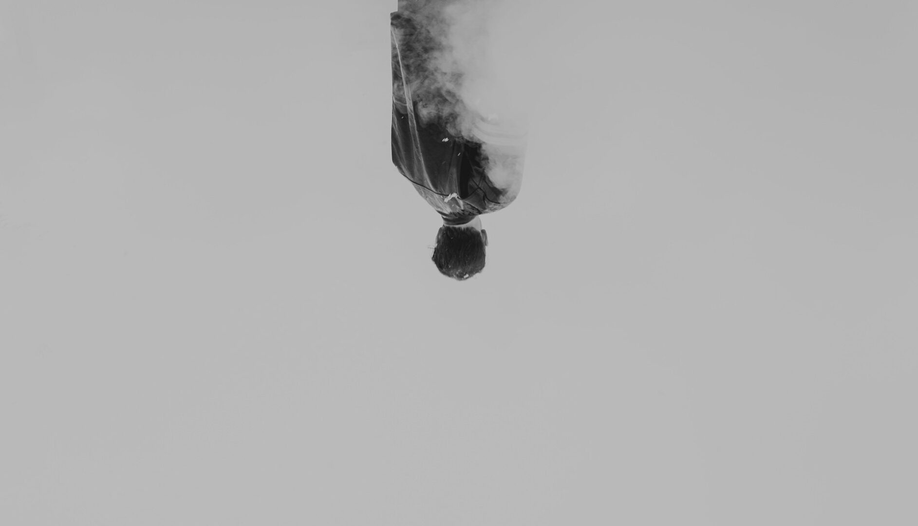 A man is in the air with his feet hanging above.