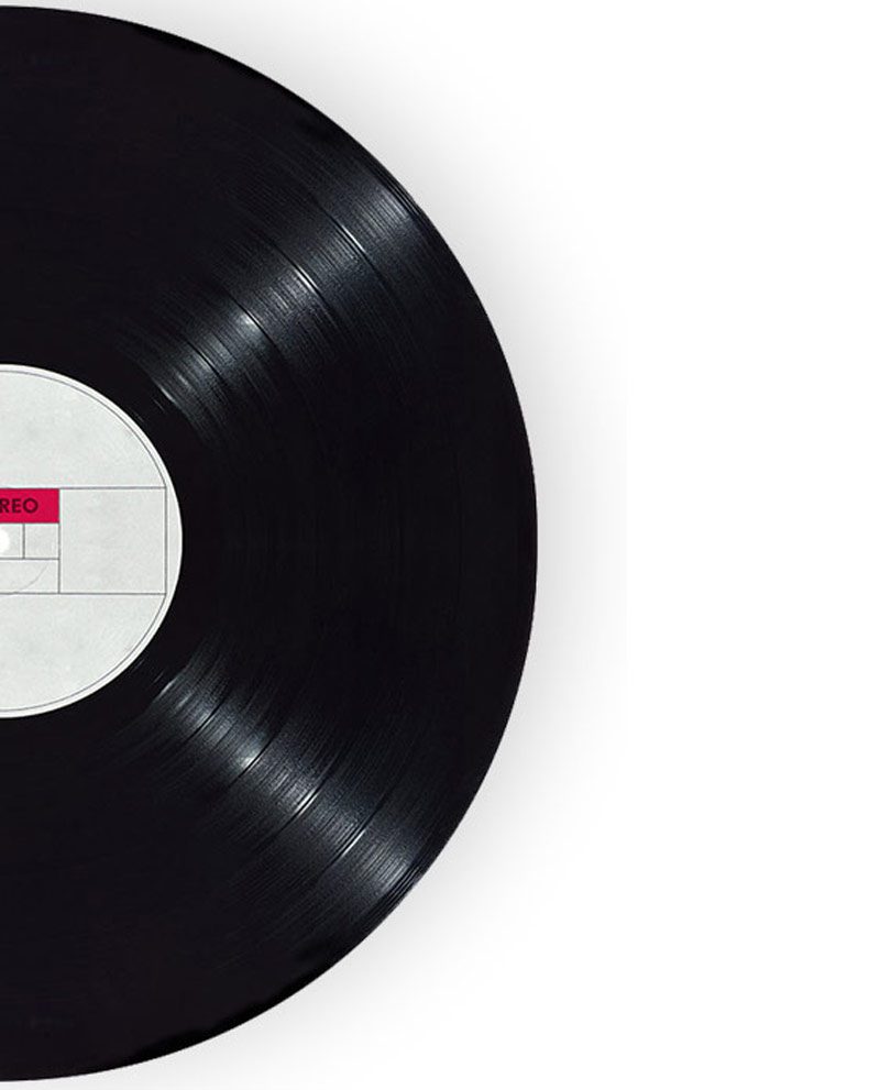 A black record with white label on top of it.