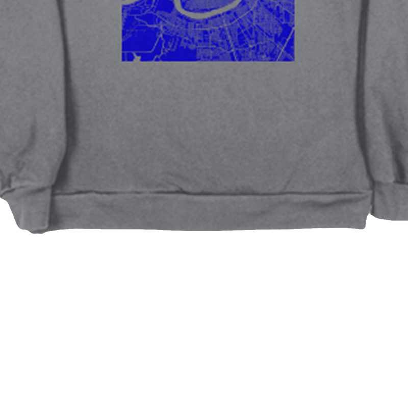 A gray sweatshirt with blue design on it.