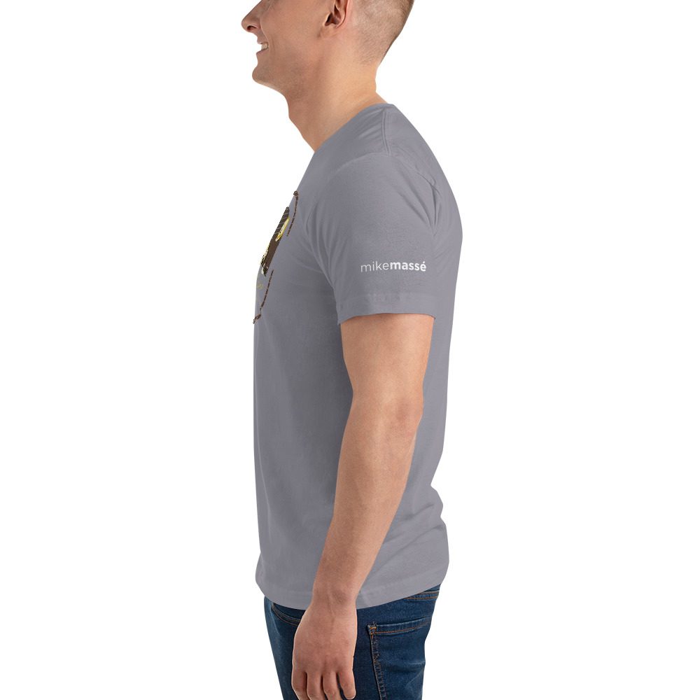 A man wearing a gray t-shirt with the words " the most important thing is to be strong."