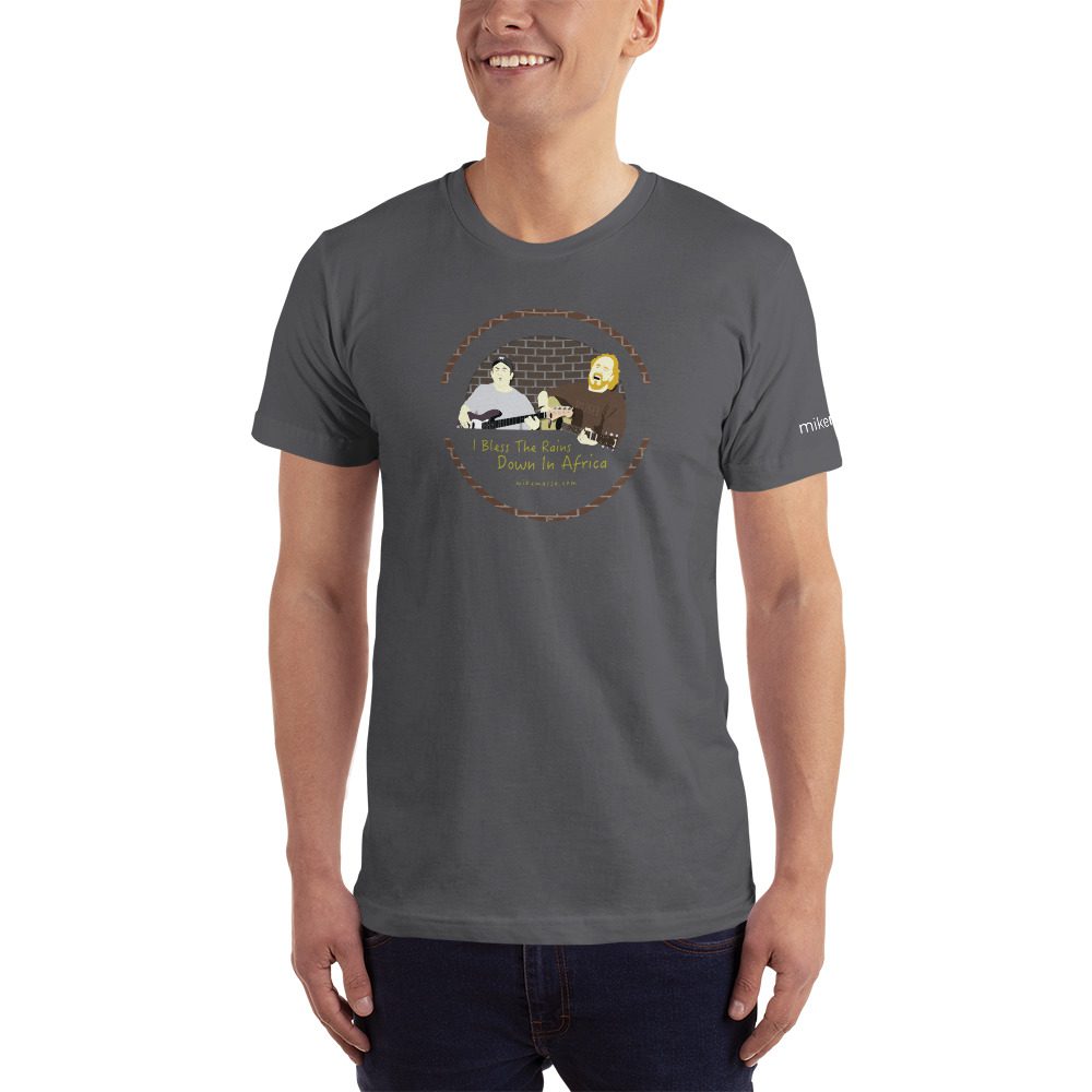 A man wearing a t-shirt with an image of a person and a dog.