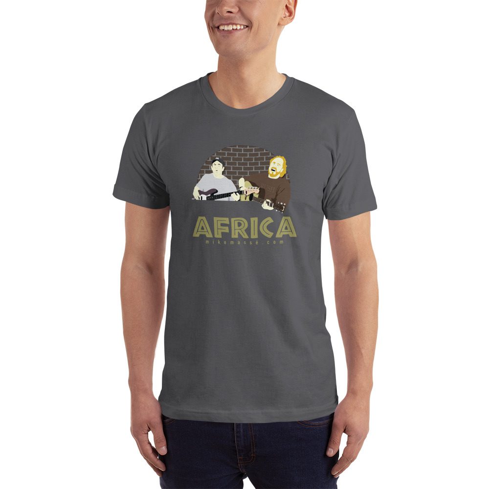 A man is wearing a t-shirt with an african scene.