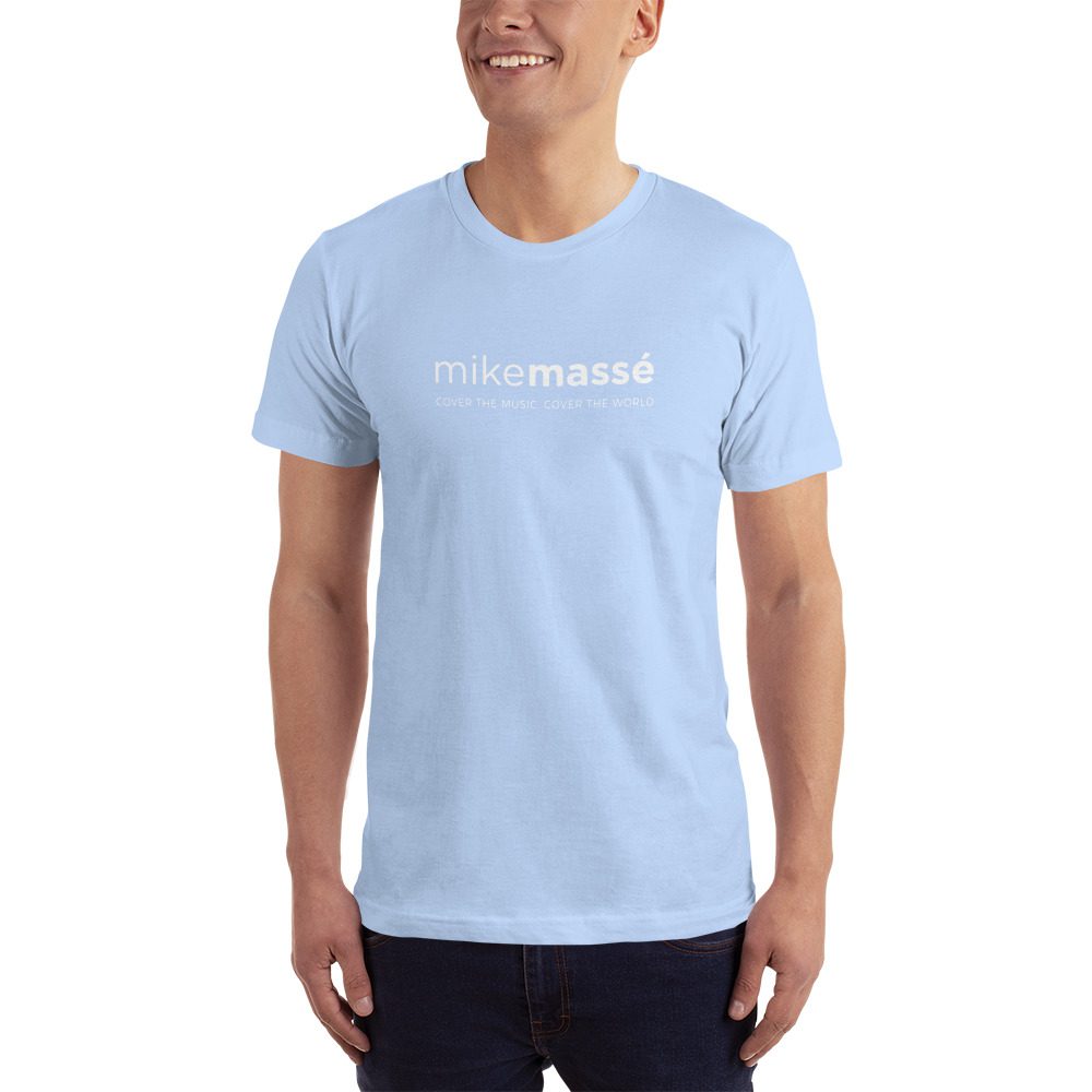 A man wearing light blue t-shirt with white lettering.