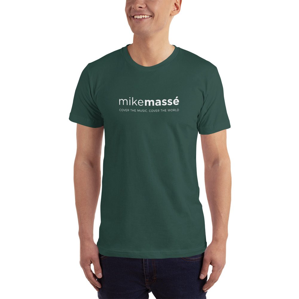 A man wearing a t-shirt with the word " mikemassed ".