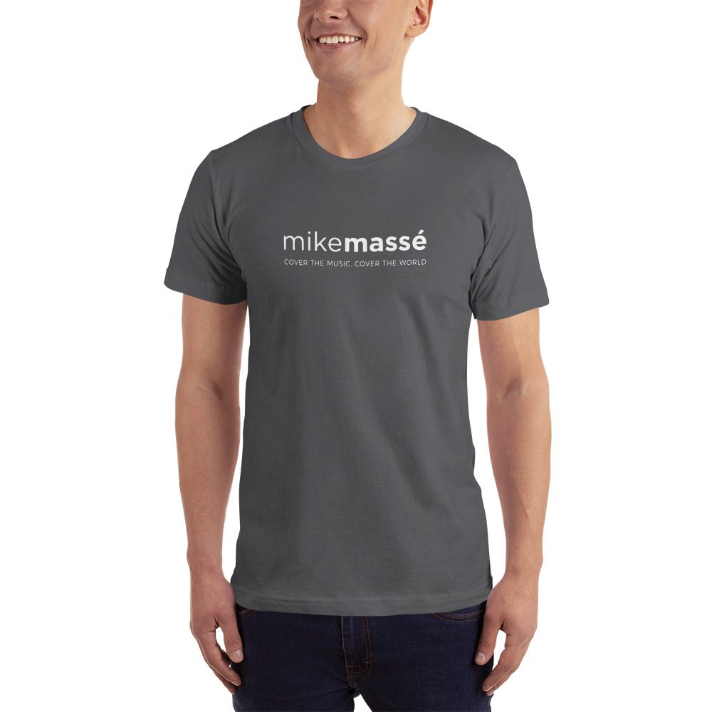 A man wearing a t-shirt with the word " mikemassed ".