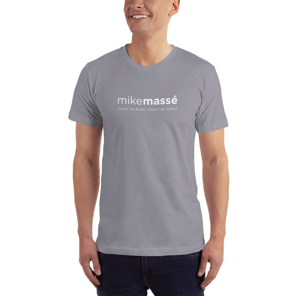 A man wearing a t-shirt with the word " micromosaic ".